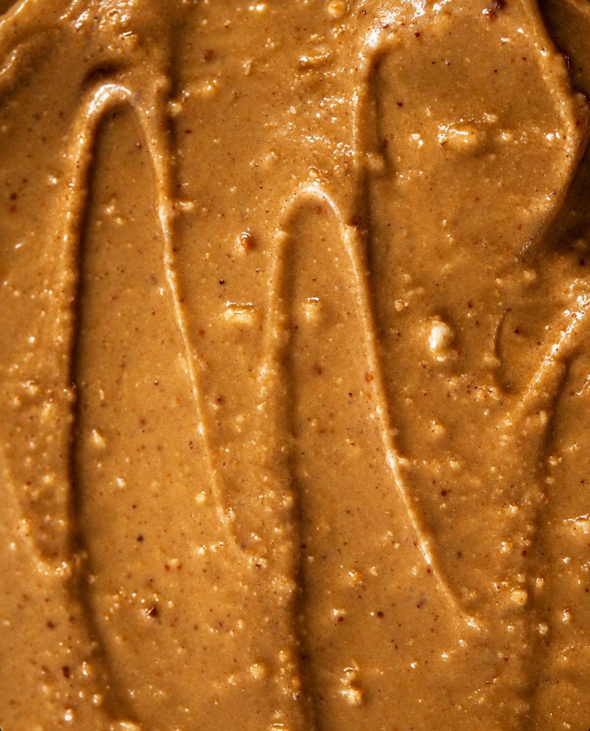 Close-up texture of stone ground Salty Peanut butter